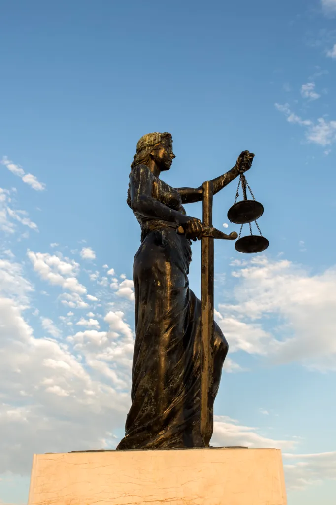 Statue of Justice at Inciralti, Izmir, Turkey, representing fair legal guidance and settlement agreement negotiations for expats